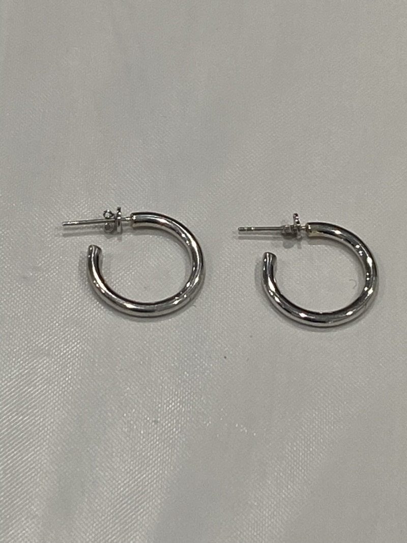 closeup of silver small tide hoop earrings by Washed Ashore brand