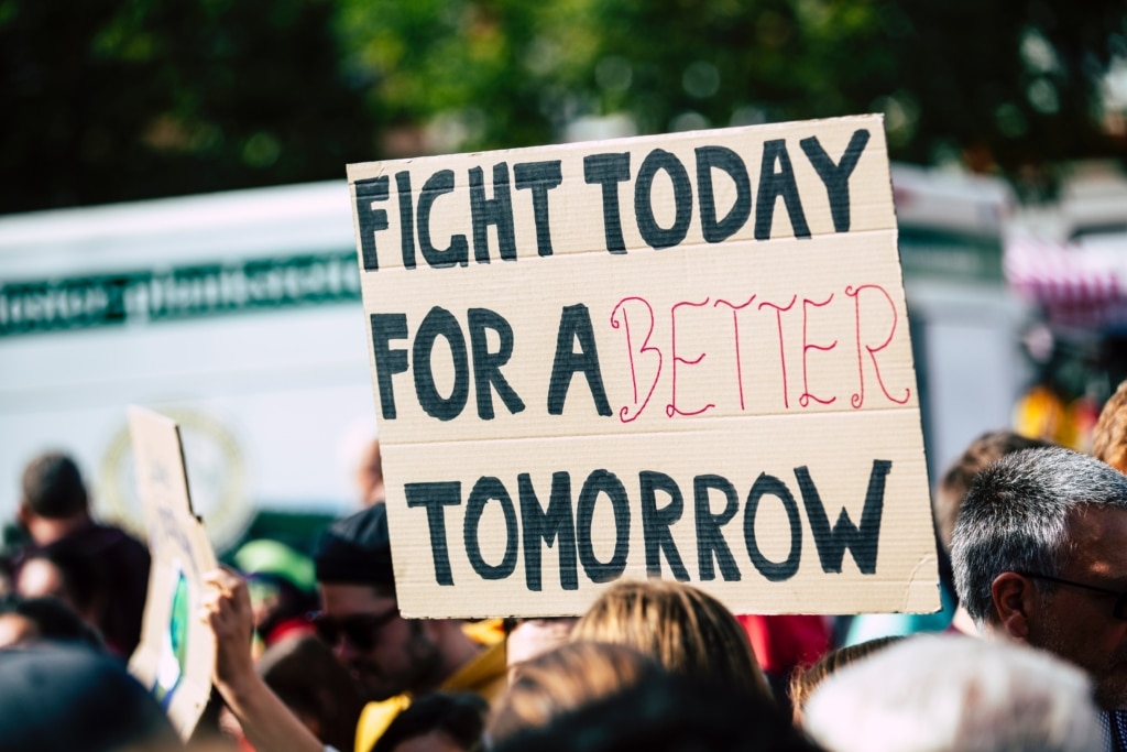 image of protesters with sign that says "fight today for a better tomorrow" from pexels-markus-spiske-2990644